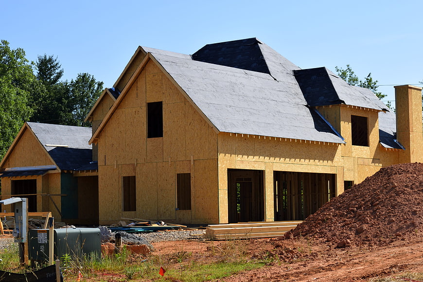 New House Under Construction with OSB Sheathing and Roofing