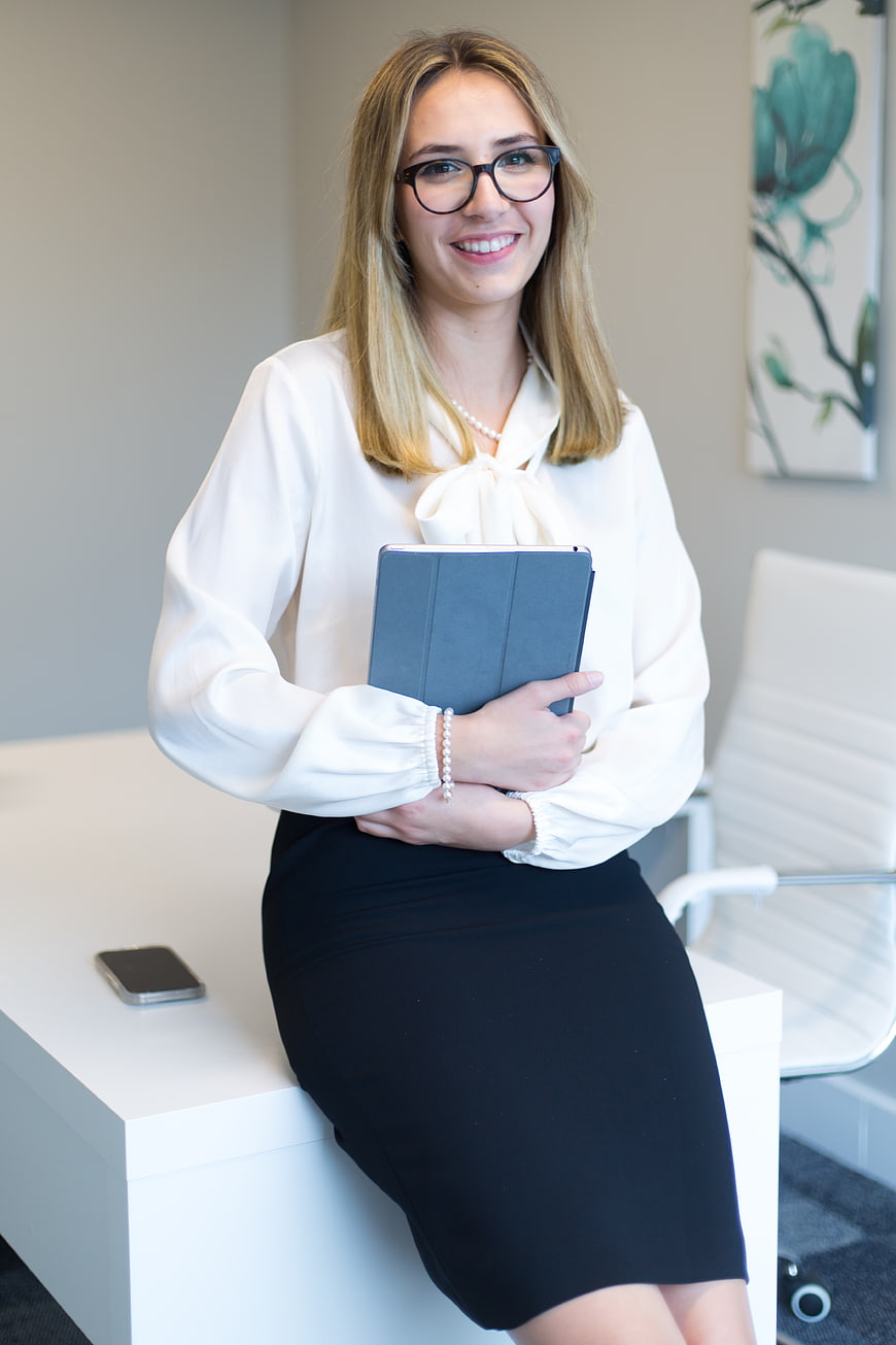 Confident Businesswoman with Tablet in Modern Office