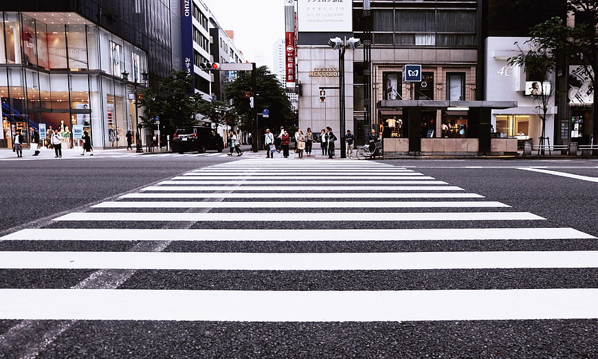 Low angle view of zebra crossing in Tokyo city street