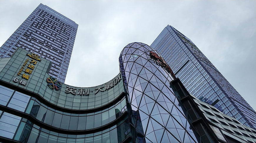 Low angle view of modern glass skyscrapers and commercial buildings