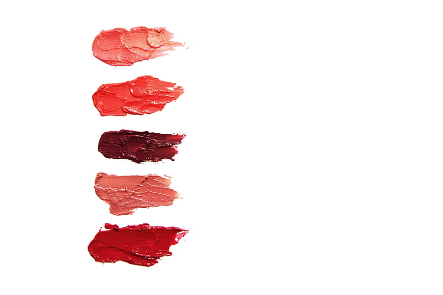 Five Red and Pink Lipstick Swatches on White Background