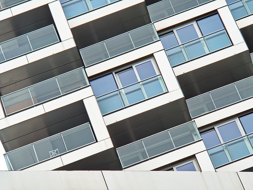 Modern Apartment Building Facade with Glass Balconies