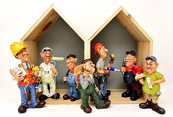 Cartoon Construction Worker Figurines in Wooden House Frame
