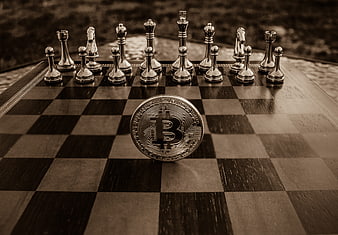 Bitcoin coin on chessboard with chess pieces in sepia tone