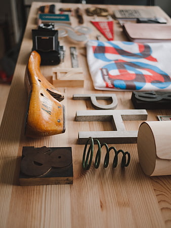 Vintage tools and design objects on a wooden table