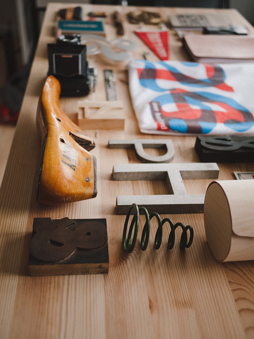 Vintage tools and design objects on a wooden table