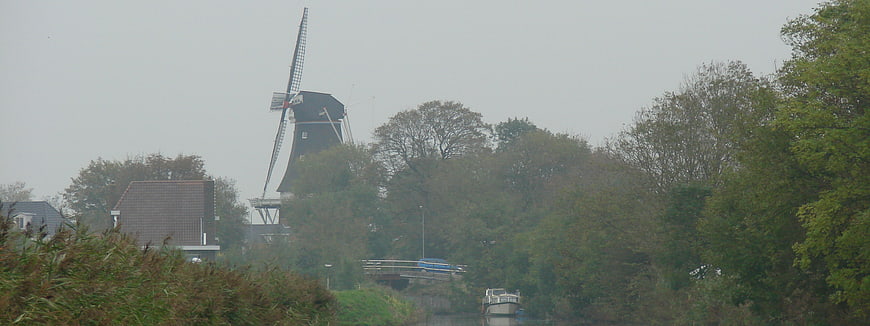 Traditional Dutch windmill in Winsum on a misty day