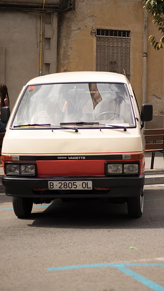 Vintage Nissan Vanette parked on a sunny street