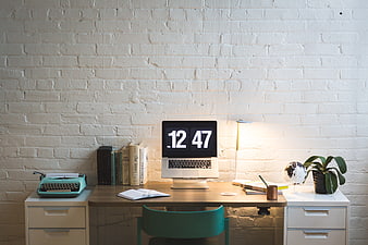 Modern Home Office Desk with Laptop and Typewriter