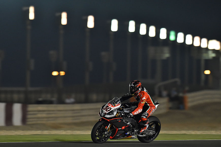 Motorcyclist Racing Superbike on Track at Night