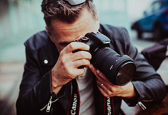 Male Photographer Shooting with DSLR Camera