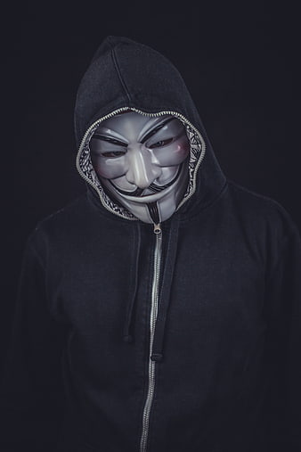 Anonymous Hacker in Black Hoodie and Guy Fawkes Mask