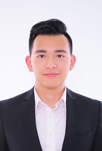 Professional Portrait of Young Asian Businessman in Black Suit