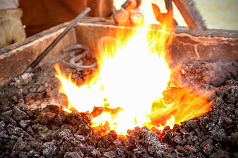 Close-up of burning coal fire in a rustic metal brazier