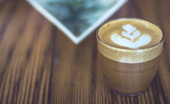 Latte Art Coffee on Wooden Table