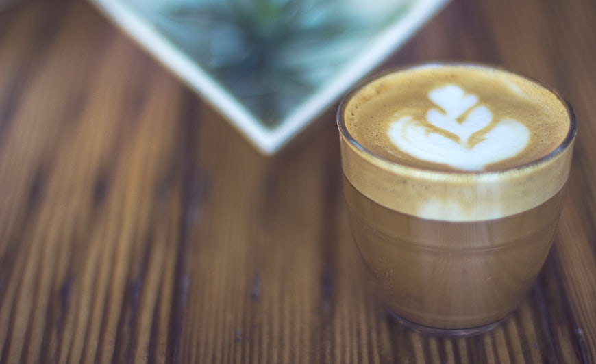Latte Art Coffee on Wooden Table