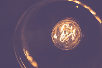 Glowing Vintage Light Bulb Filament Close Up