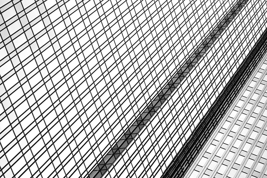 Black and white abstract modern building facade grid pattern