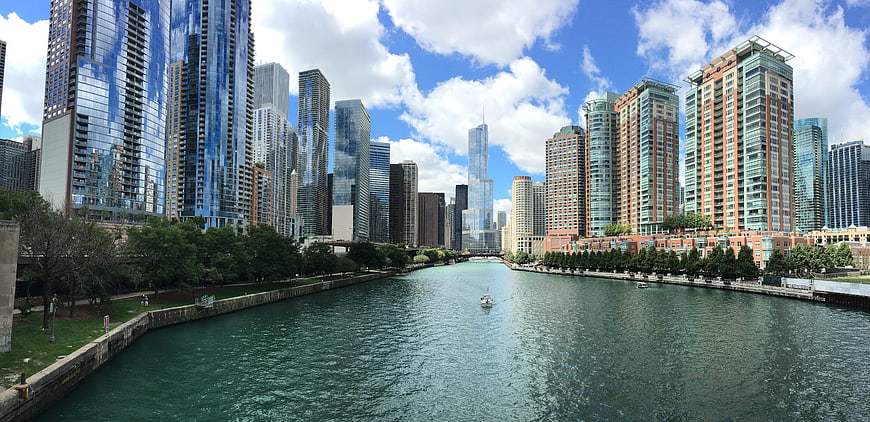 Chicago River Skyline with Skyscrapers and Blue Sky