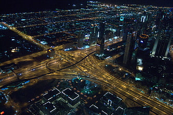 Aerial Night View of Dubai Cityscape and Highway Interchange