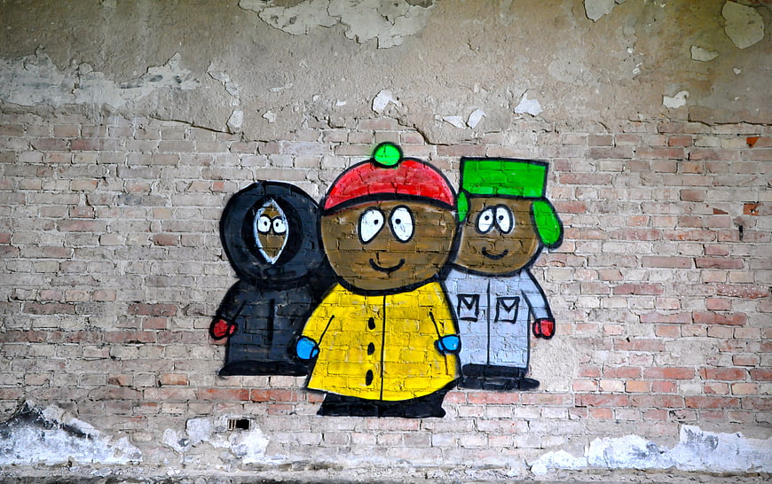 South Park Style Cartoon Characters Street Art On Weathered Brick Wall