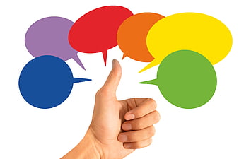 Hand Thumbs Up With Colorful Speech Bubbles On White Background