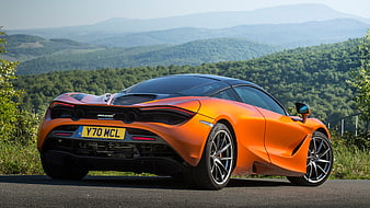 Orange McLaren 720s Sports Car on Scenic Mountain Road