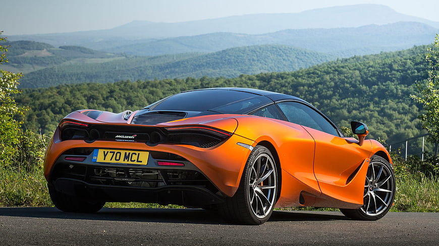Orange McLaren 720s Sports Car on Scenic Mountain Road