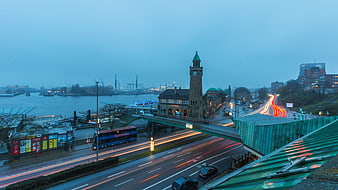 Long exposure Hamburg Landungsbrücken at dusk with light trails