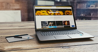 Laptop and Graphics Tablet on Wooden Desk