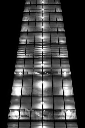 Black and white abstract office staircase through blinds