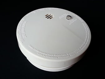 White Smoke Detector on Black Background