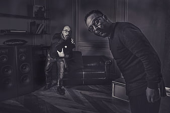 Two Men in Dramatic Black and White Studio Setting