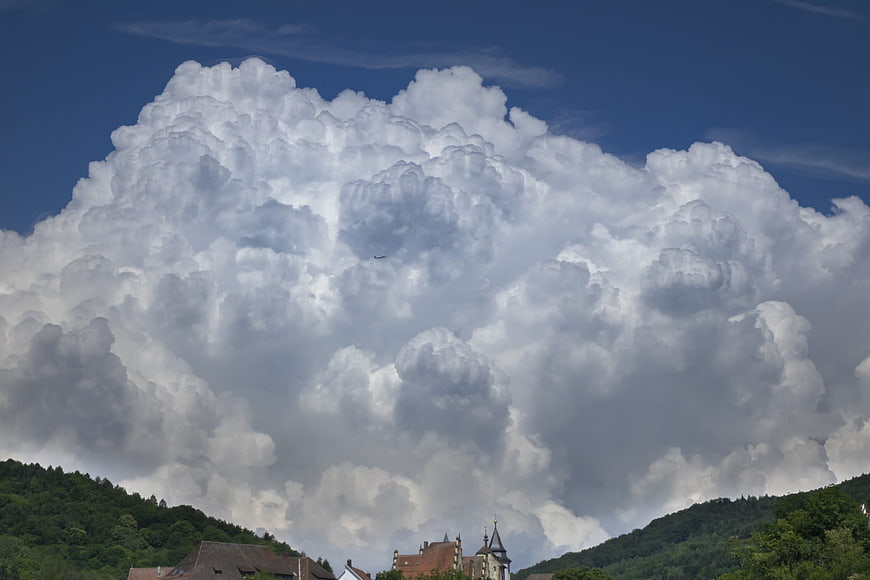 Massive Cumulus Cloud Formation Over European Village