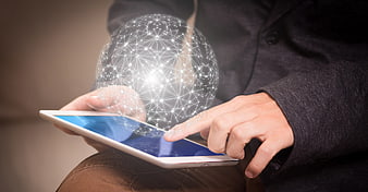 Businessman touching tablet with digital network globe overlay