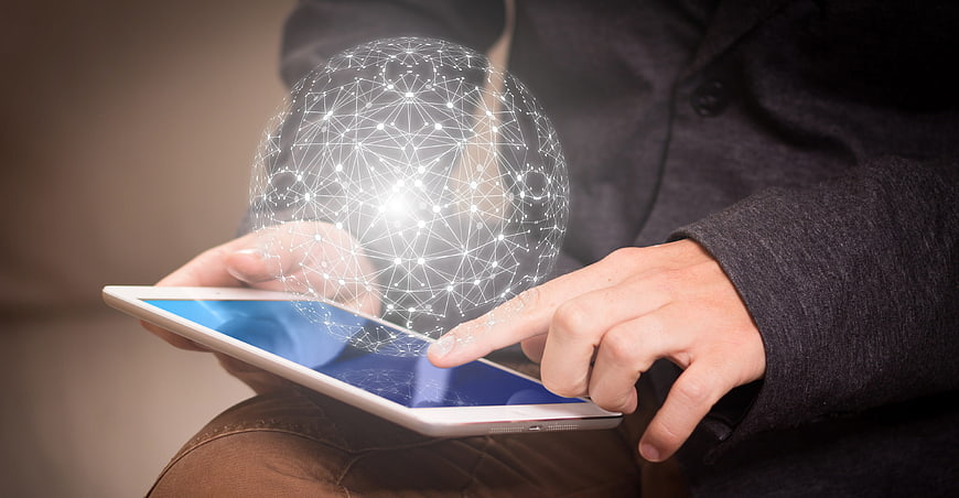 Businessman touching tablet with digital network globe overlay