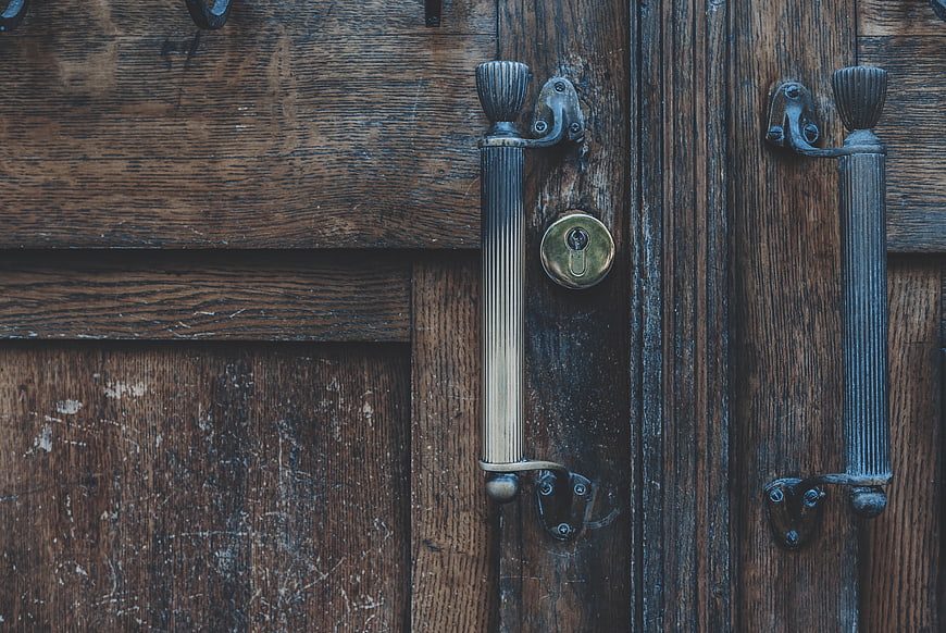 Vintage Wooden Door with Antique Brass Handles and Lock
