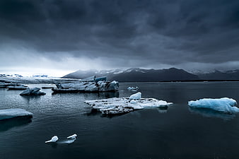 Dramatic Glacial Lagoon with Icebergs and Mountains