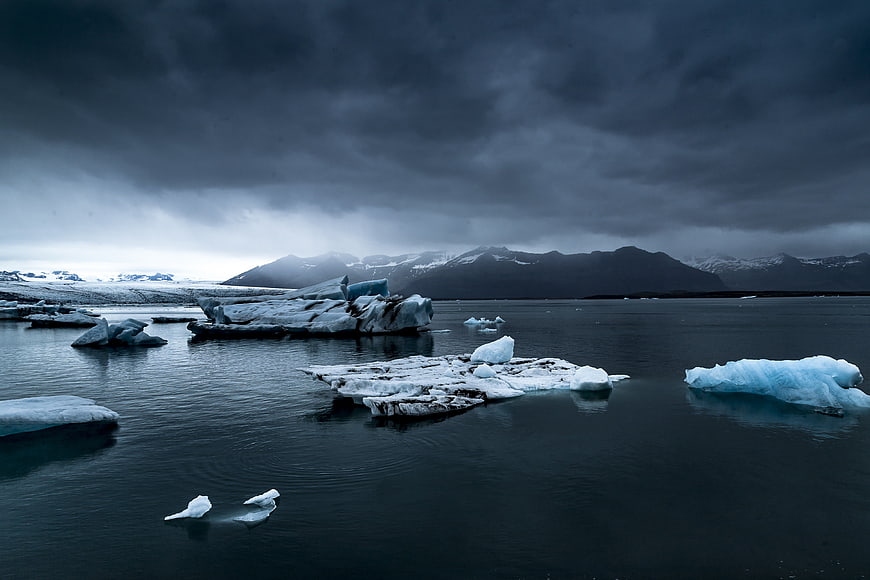 Dramatic Glacial Lagoon with Icebergs and Mountains