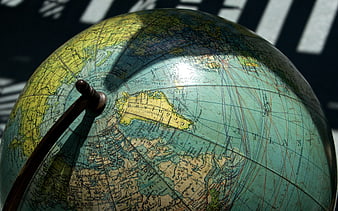 Vintage Globe Close-Up with Wooden Pointer
