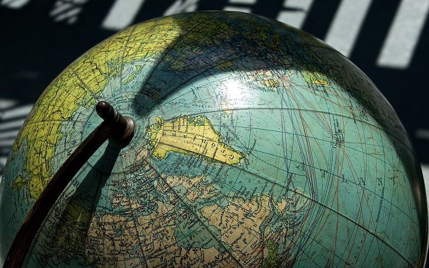 Vintage Globe Close-Up with Wooden Pointer