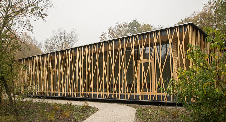 Modern wooden lattice architecture in autumn forest