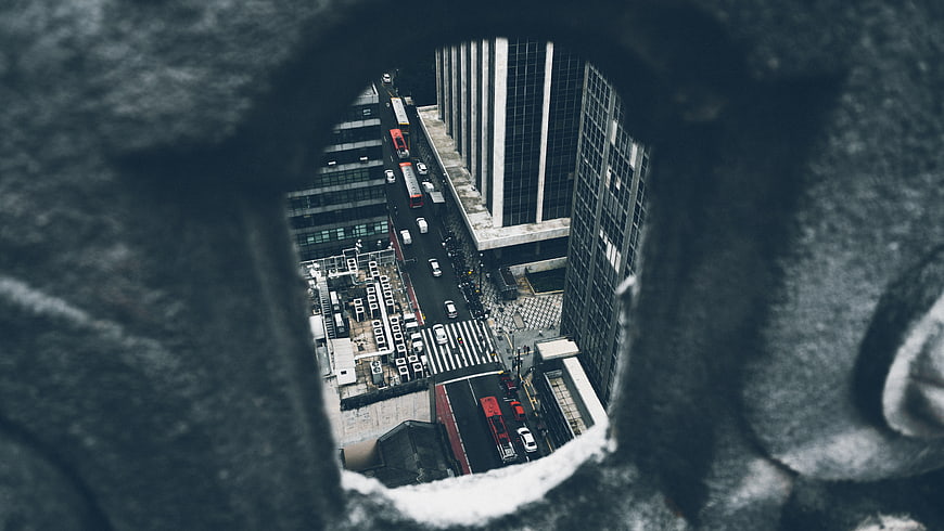 High angle view of city street through stone hole