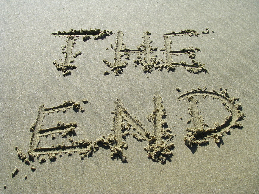 The words THE END written in sand on a beach