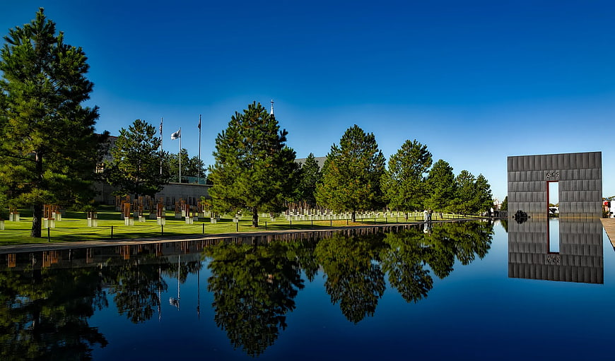 Reflective Pool at Military Cemetery with Memorial Gate