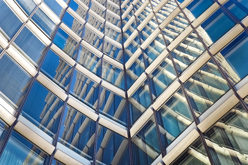 Abstract geometric pattern of modern glass skyscraper facade