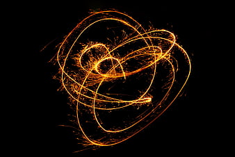 Golden Sparkler Light Trails on Black Background