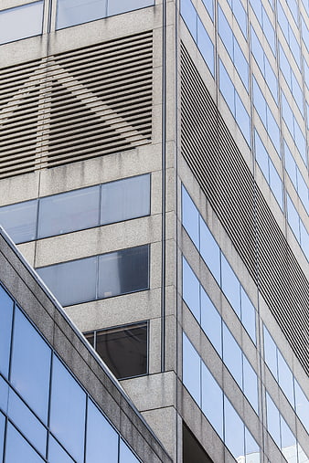 Modern Office Building Facade with Glass Windows and Concrete