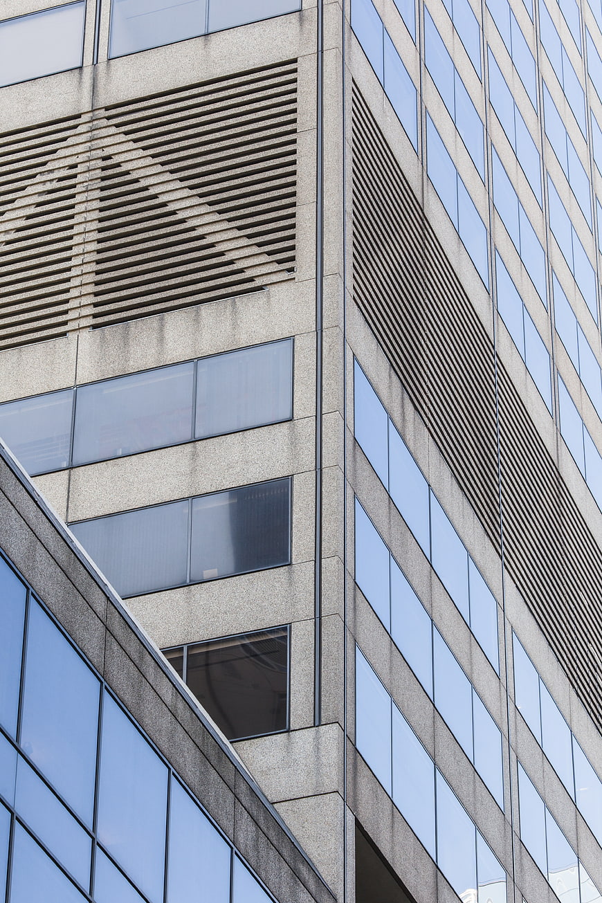 Modern Office Building Facade with Glass Windows and Concrete