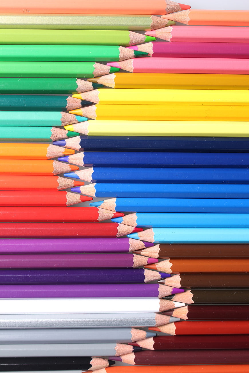 Colorful pencils arranged in a zigzag pattern